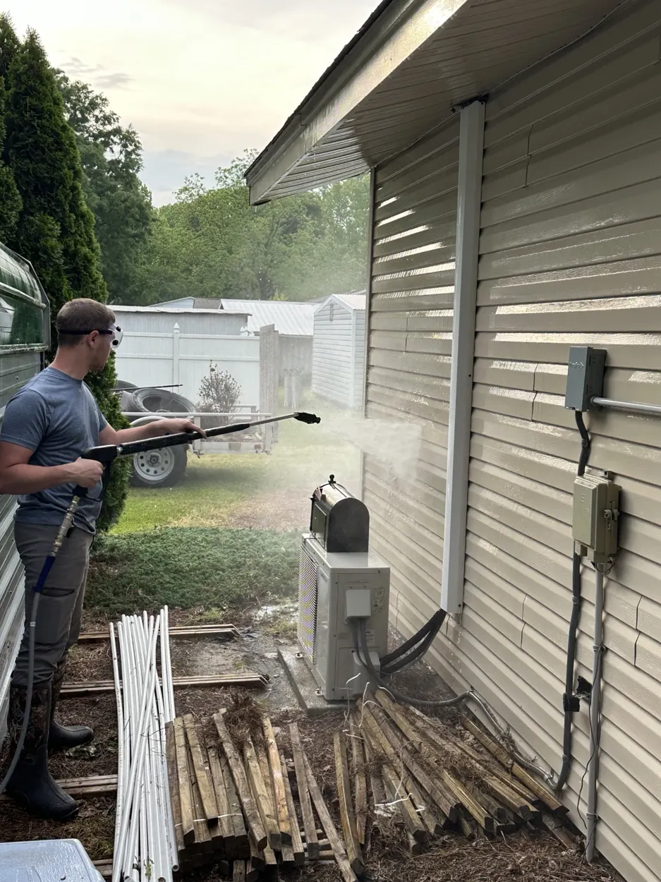 JBE team washing a home exterior